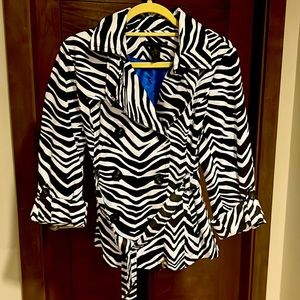 .As new, Water resistant, long /half sleeve, waist belt.